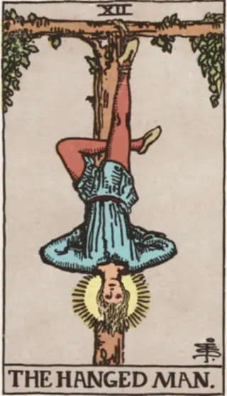 The Hanged Man: a young man hanging upside down by one ankle from a living wooden frame, his hands behind his back and a halo of light around his head.