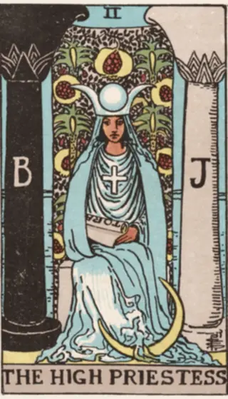 The High Priestess: a veiled figure seated between a dark pillar lettered B and a pale one lettered J, a scroll in her lap, a crescent moon at her feet and a curtain of pomegranates behind.